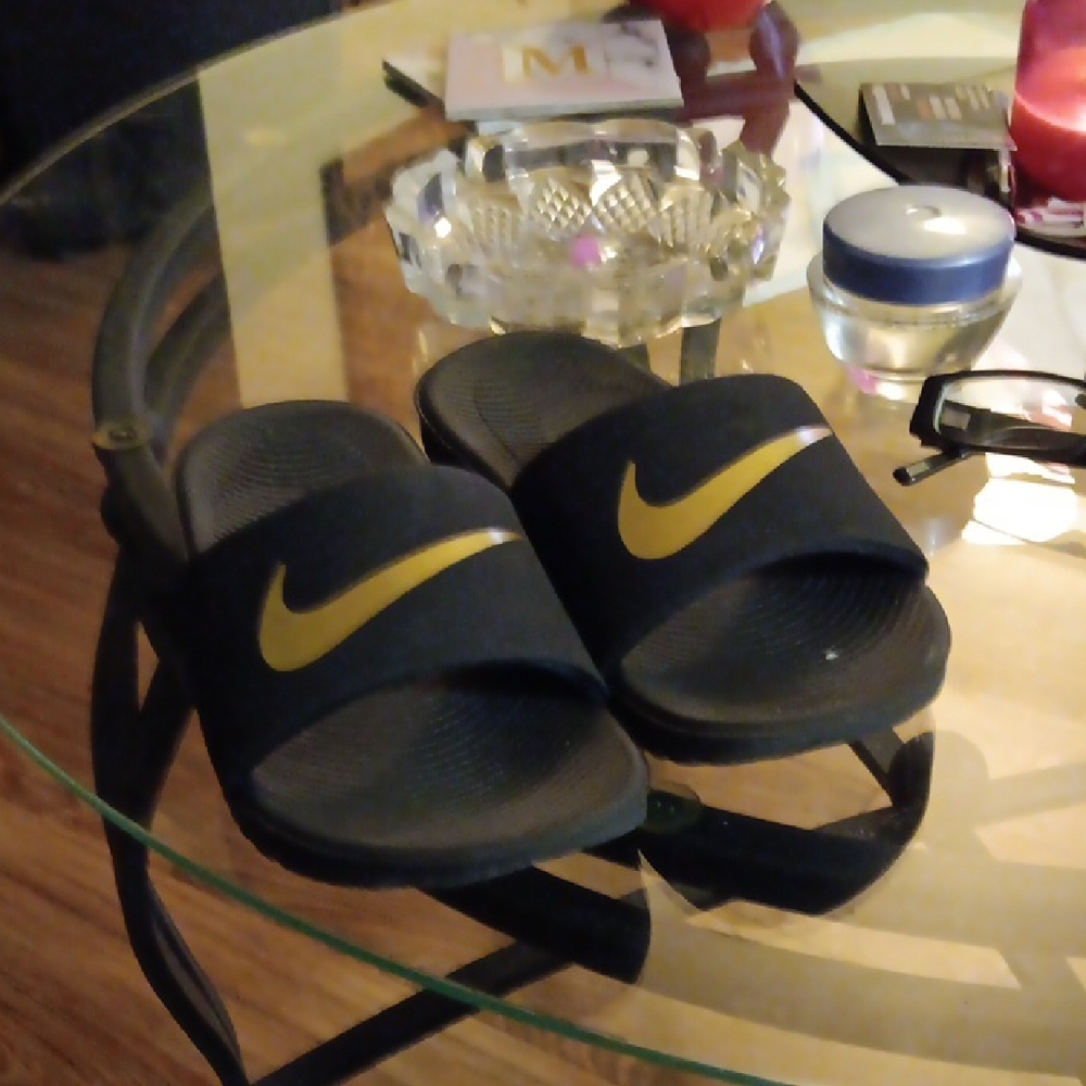 Nike Black and Gold Slides
